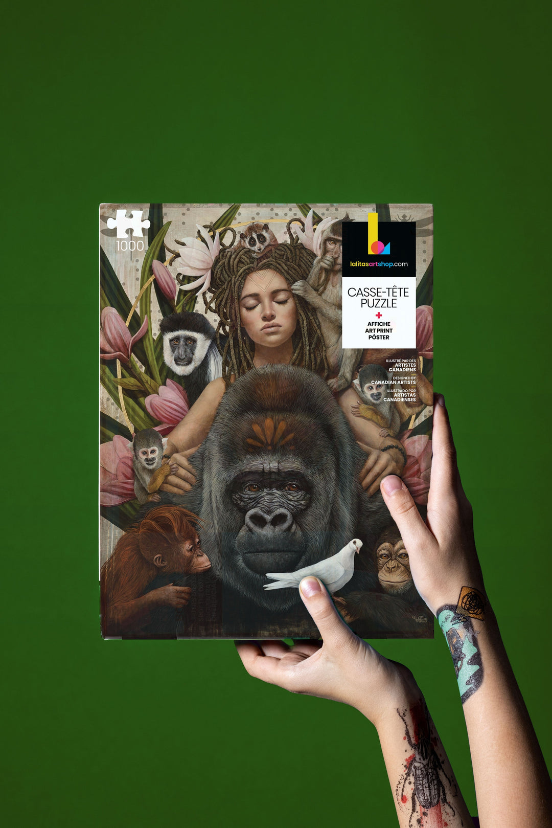 Hands holding the 'Primates' 1000-piece jigsaw puzzle box featuring a detailed illustration of various primates and a serene figure.