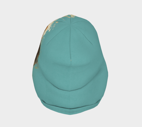 Top view of a teal beanie featuring a vibrant abstract portrait design by Élise Charette