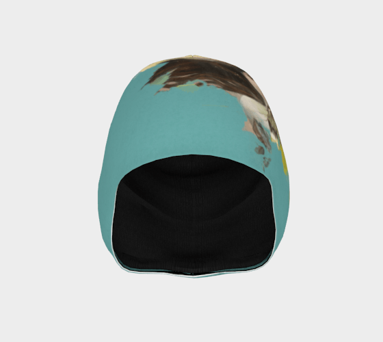 Interior view of a teal beanie showing a black lining and the exterior abstract art