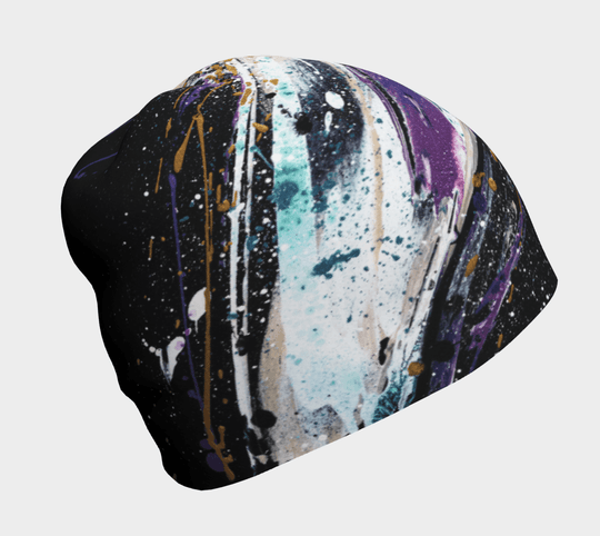Abracadabra Beanie showcasing an abstract splatter art design in purple, white, and gold on black.