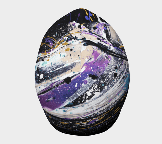 Front view of the Abracadabra Beanie, emphasizing the dynamic paint-like art with touches of blue and gold.