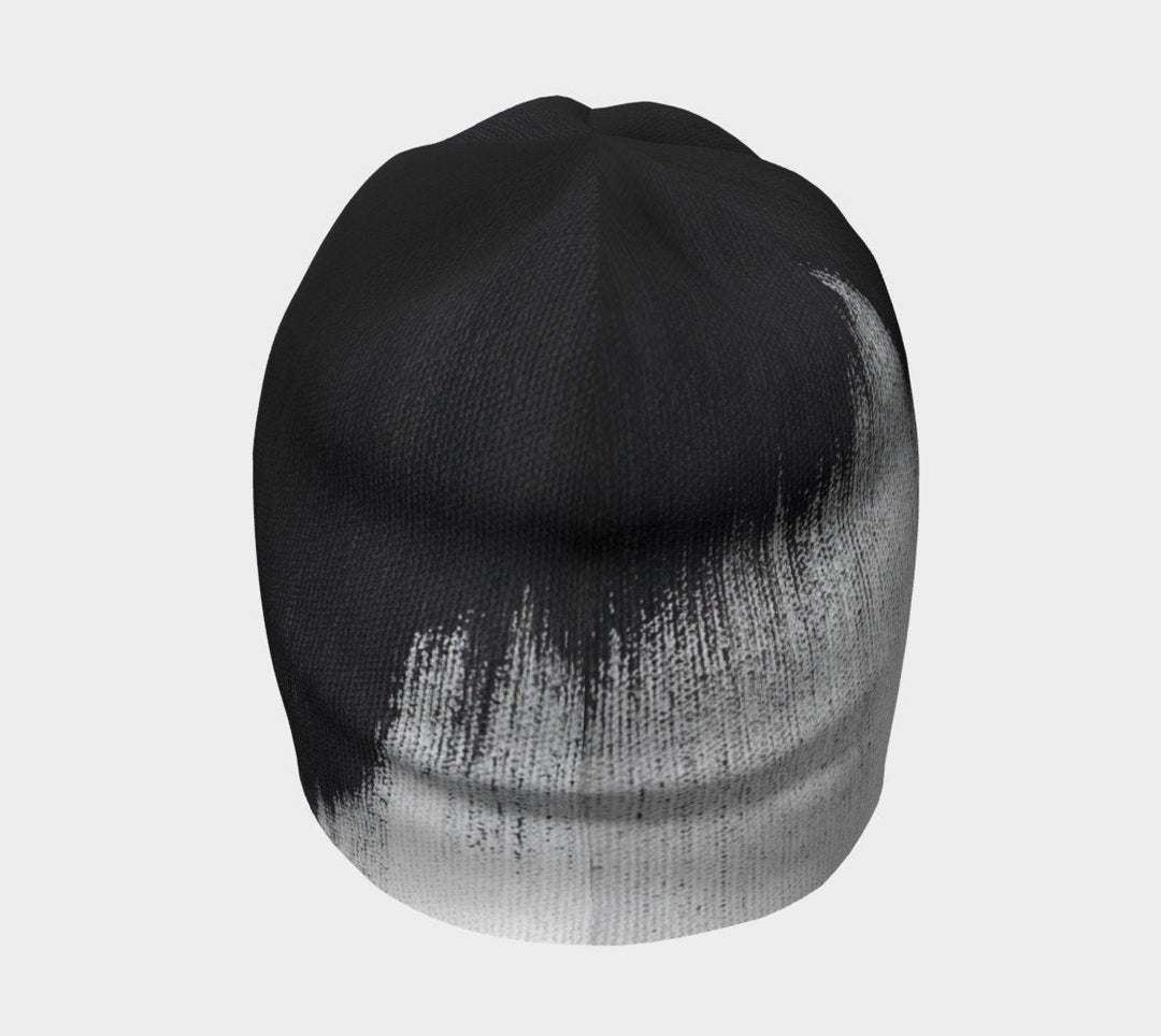 Side view of the beanie highlighting the abstract brush stroke design.