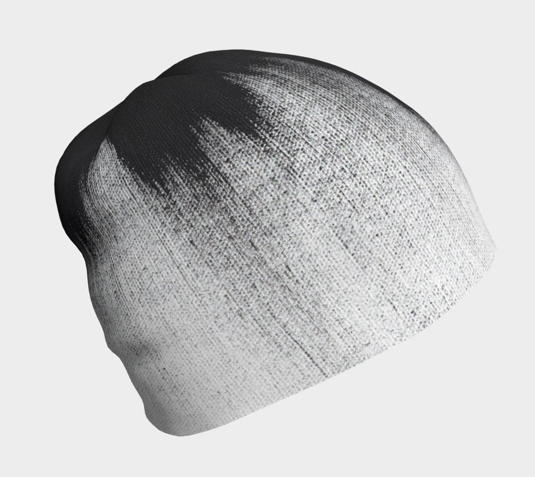 Black and white abstract brush stroke pattern on a grey beanie.