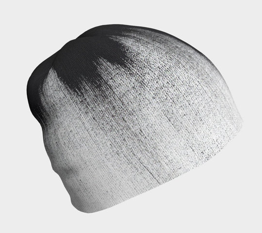 Black and white abstract brush stroke pattern on a grey beanie.