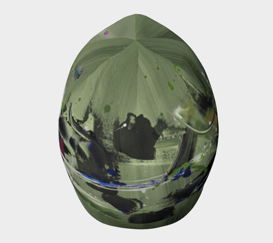 Top view of the green abstract art beanie against a white background.