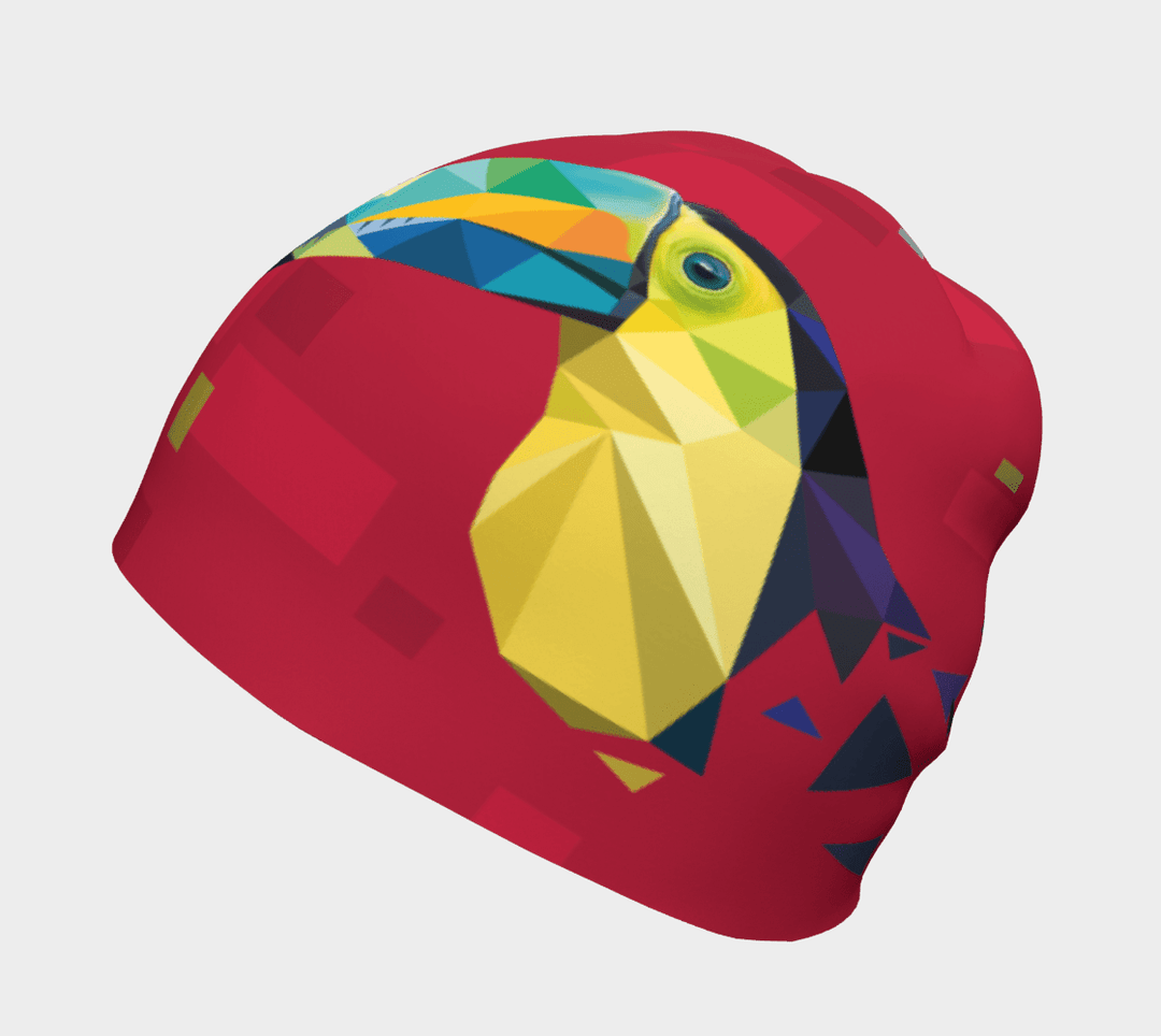 Red beanie featuring a geometric toucan design, viewed from a side-top angle.