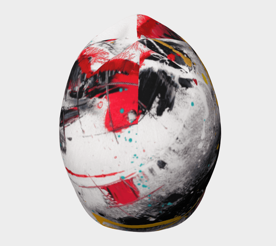 A beanie featuring a dynamic abstract art print with bold red and yellow streaks.
