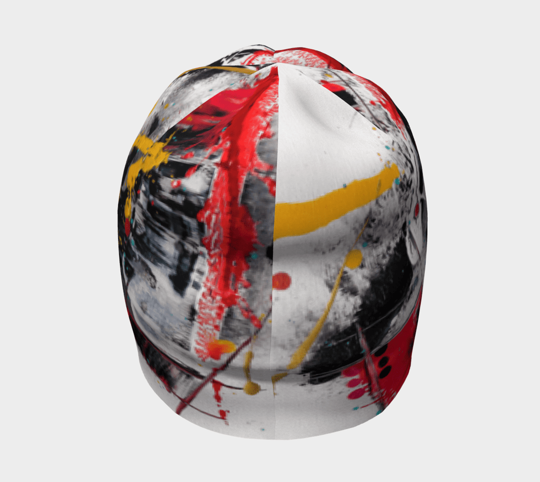 A beanie showcasing a vibrant abstract pattern with black, white, red, and yellow elements.
