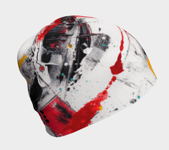 White and red abstract splatter art on a grey beanie, shown from the side.