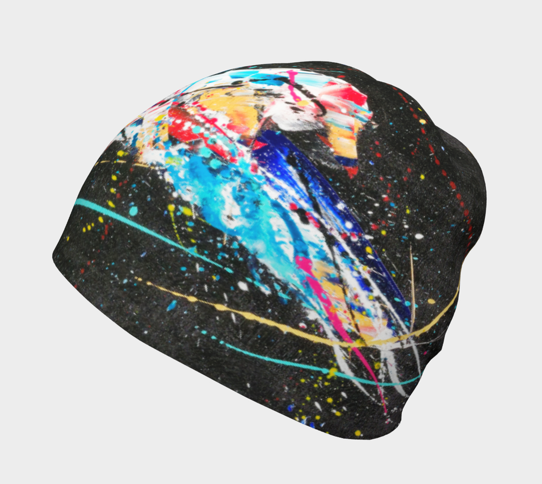 Side view of the black beanie featuring a black background with vibrant abstract paint splatters.