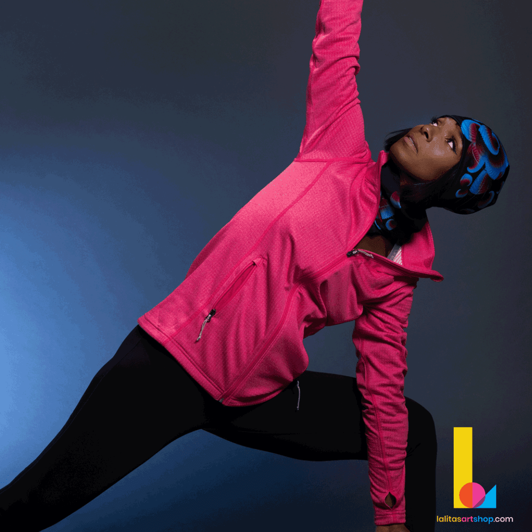 Woman in a pink jacket doing yoga while wearing the Blue Flowers beanie