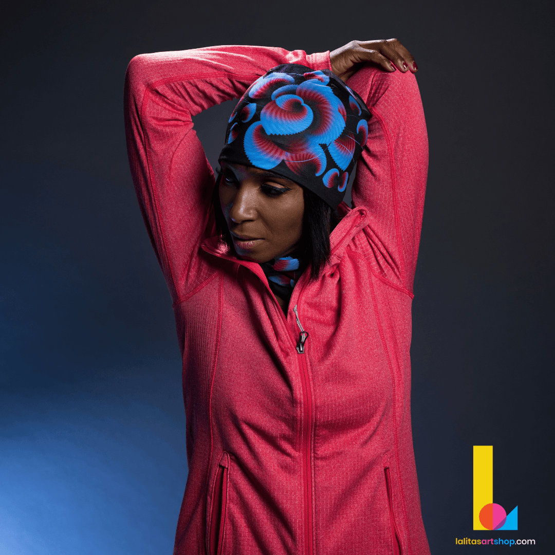 Woman in a red jacket wearing the Blue Flowers beanie and neck warmer