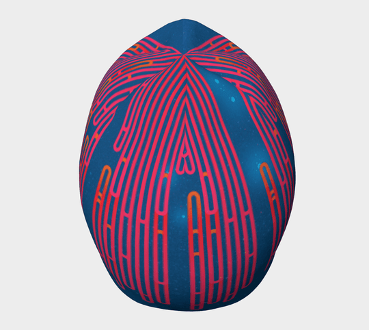 Close-up of the side of a blue beanie with a dynamic pink and orange pattern.