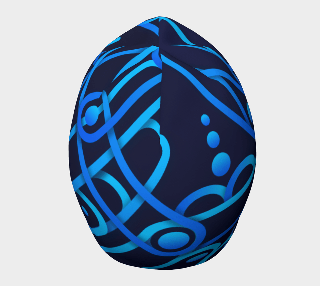 Side view of a dark blue beanie with a repeating abstract geometric pattern in bright blues.