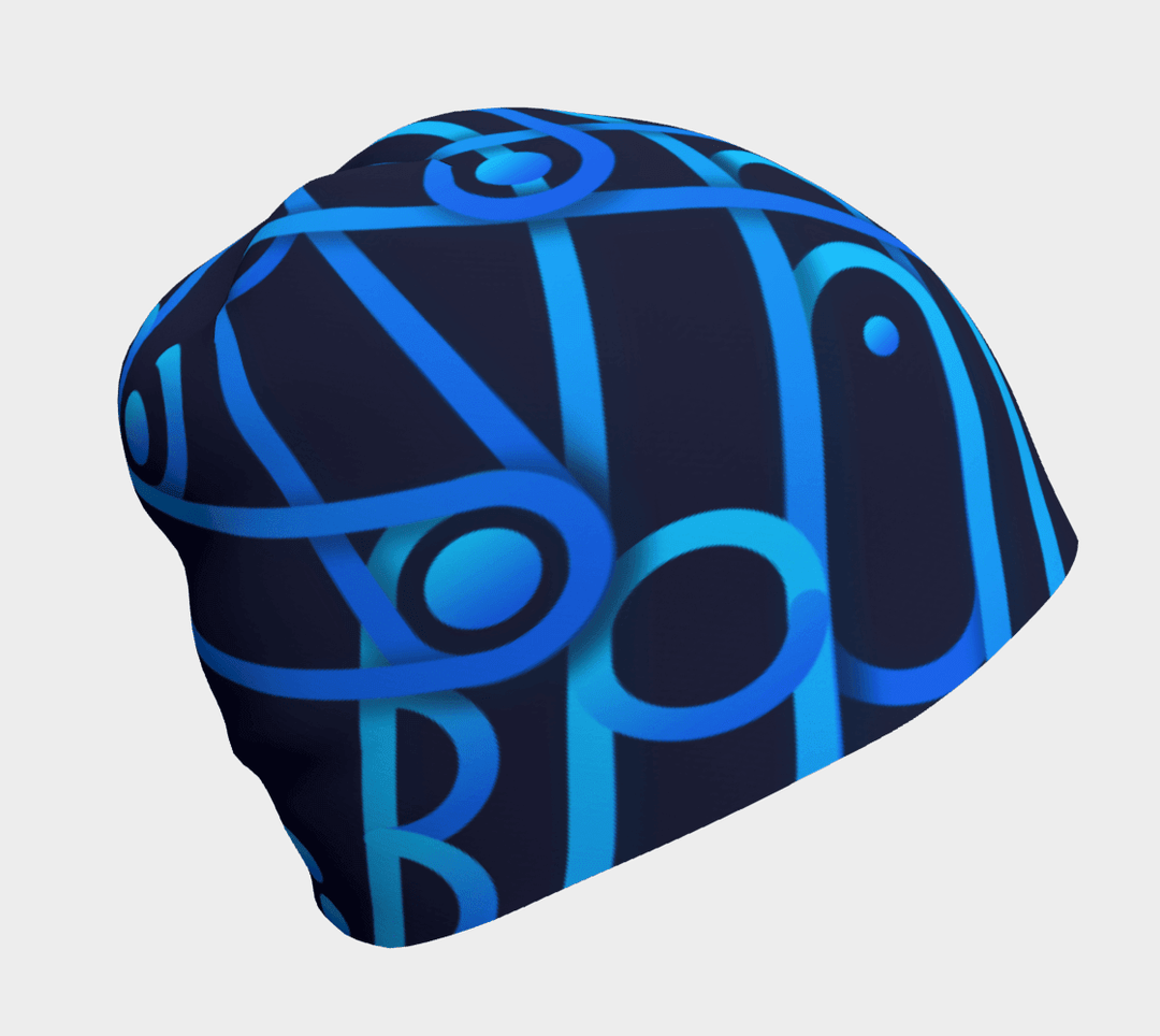 Close-up of a dark blue beanie with a repeating abstract geometric pattern in bright blues.