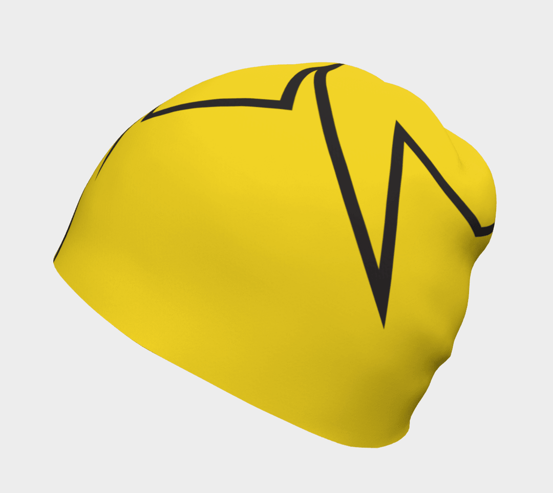 Close-up of a yellow beanie featuring a bold black broken line design.