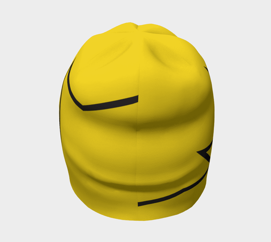 Top view of a yellow beanie with a black broken line design, exhibiting its rounded shape.