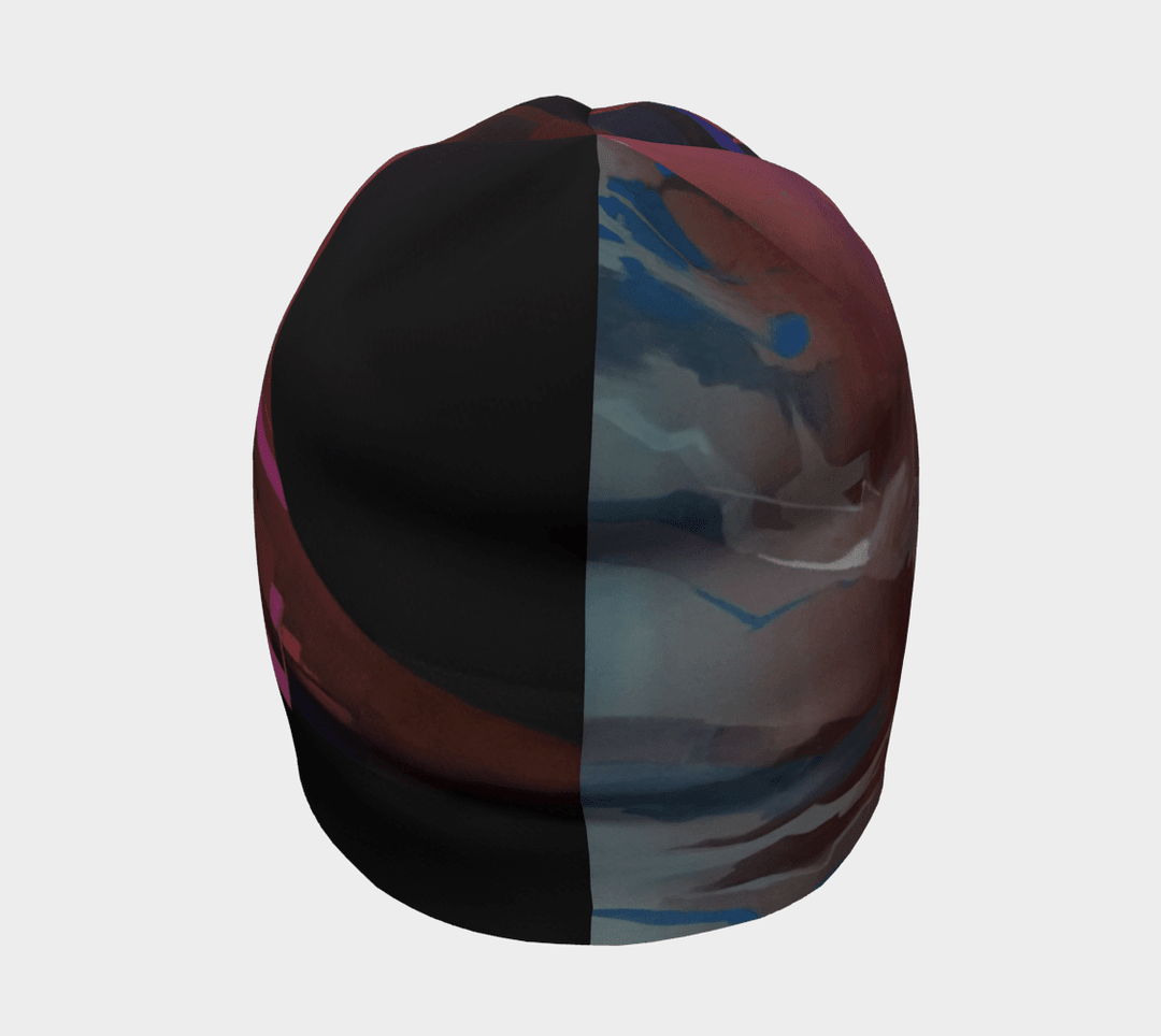 A view of the City Beanie from the back, showing a split design with abstract art on one side and a darker color on the other.