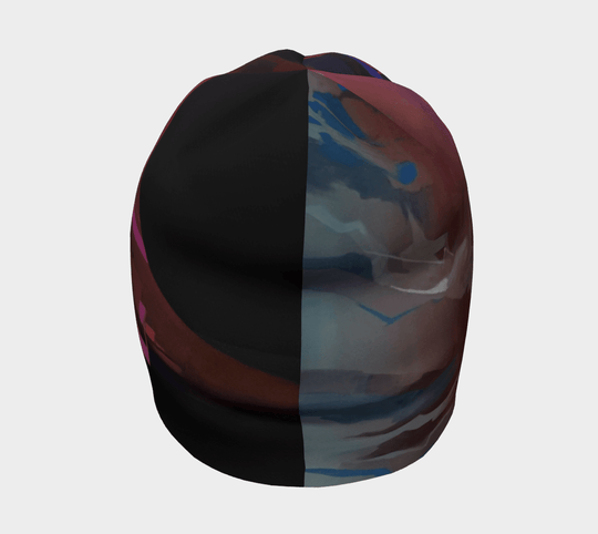A view of the City Beanie from the back, showing a split design with abstract art on one side and a darker color on the other.