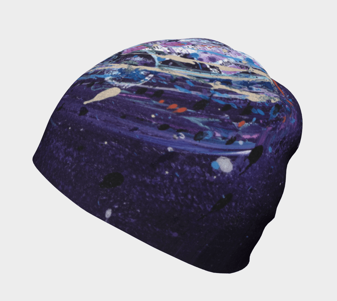 A beanie featuring a dynamic abstract art pattern with purple, blue, and pink accents.