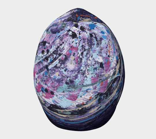 Top-down view of the Cosmic Beanie showcasing its colorful, abstract design.