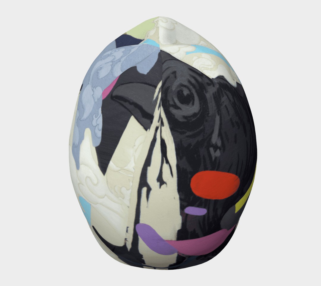 Full view of the abstract crow graphic beanie hat with bold black and colorful shapes