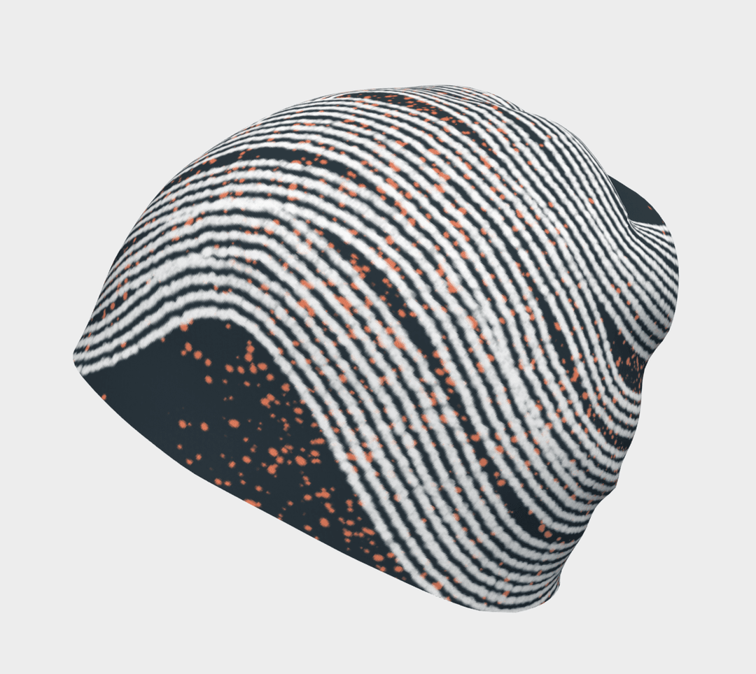 Close-up of a Dark Steel Beanie showing its abstract wavy stripe pattern with orange speckles.