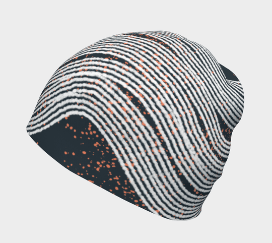 Close-up of a Dark Steel Beanie showing its abstract wavy stripe pattern with orange speckles.