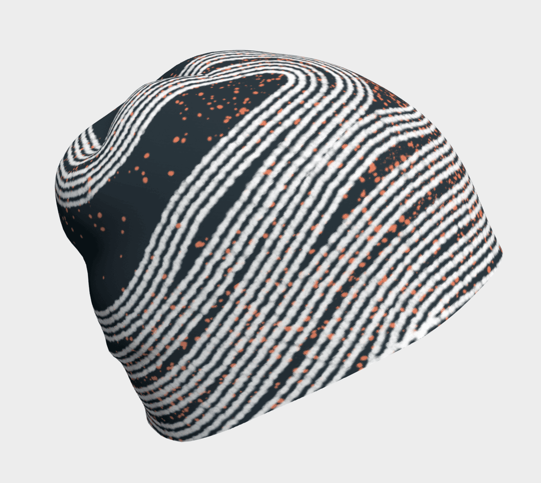 Close-up of a Dark Steel Beanie showing its abstract wavy stripe pattern with orange speckles.