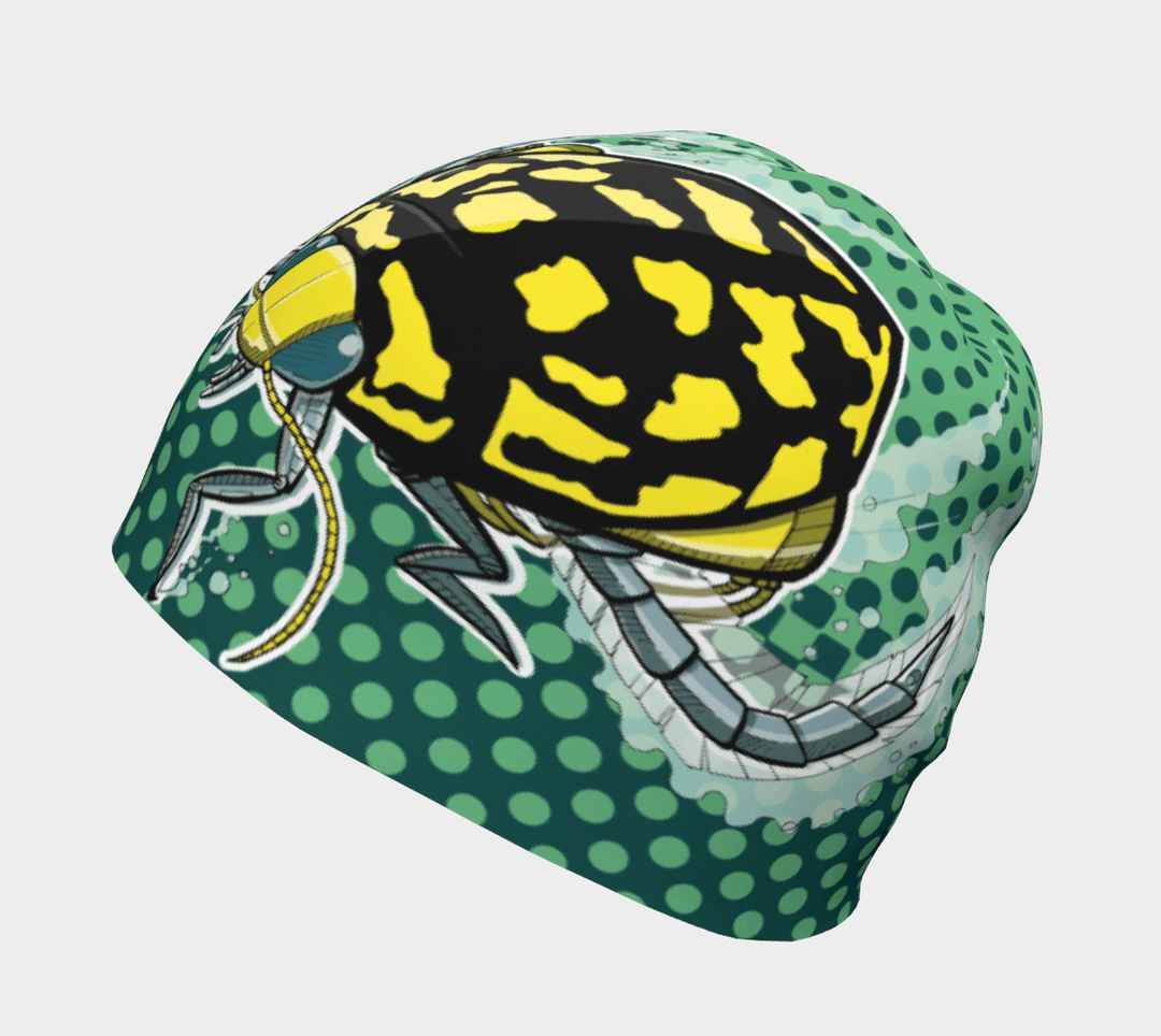 Close-up of the Diving Beetle Beanie showcasing the beetle artwork on a green polka dot background.