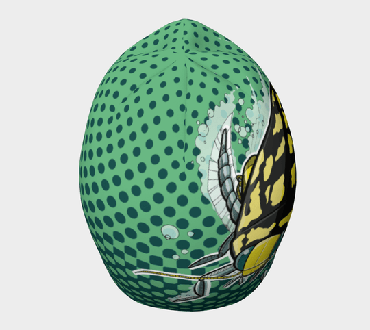 Side view of the Diving Beetle Beanie, displaying the detailed beetle illustration against a green dotted backdrop.