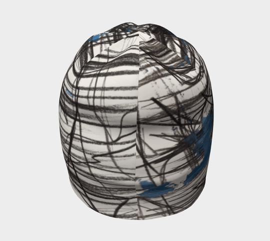 Top-down view of the Expressive Sketch Beanie, highlighting its all-over abstract print.