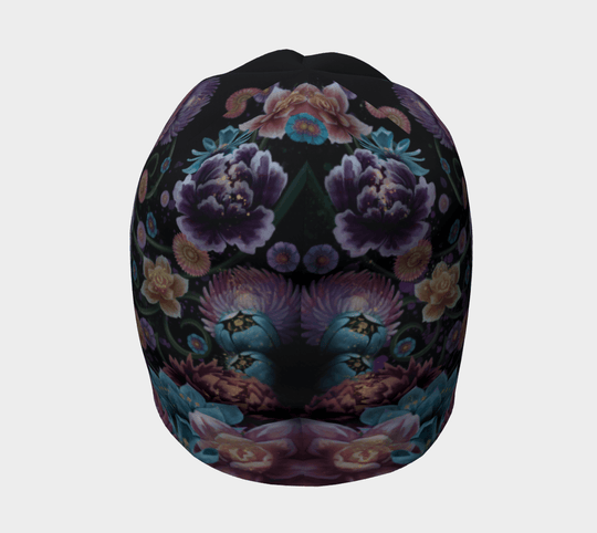 Top view of the beanie, displaying the symmetrical arrangement of floral motifs against a dark background.
