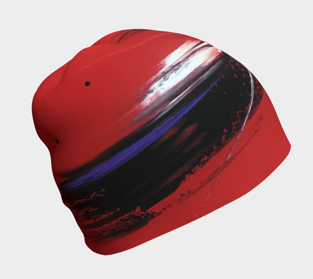 Red abstract art beanie with black and white brushstrokes, shown from the side.