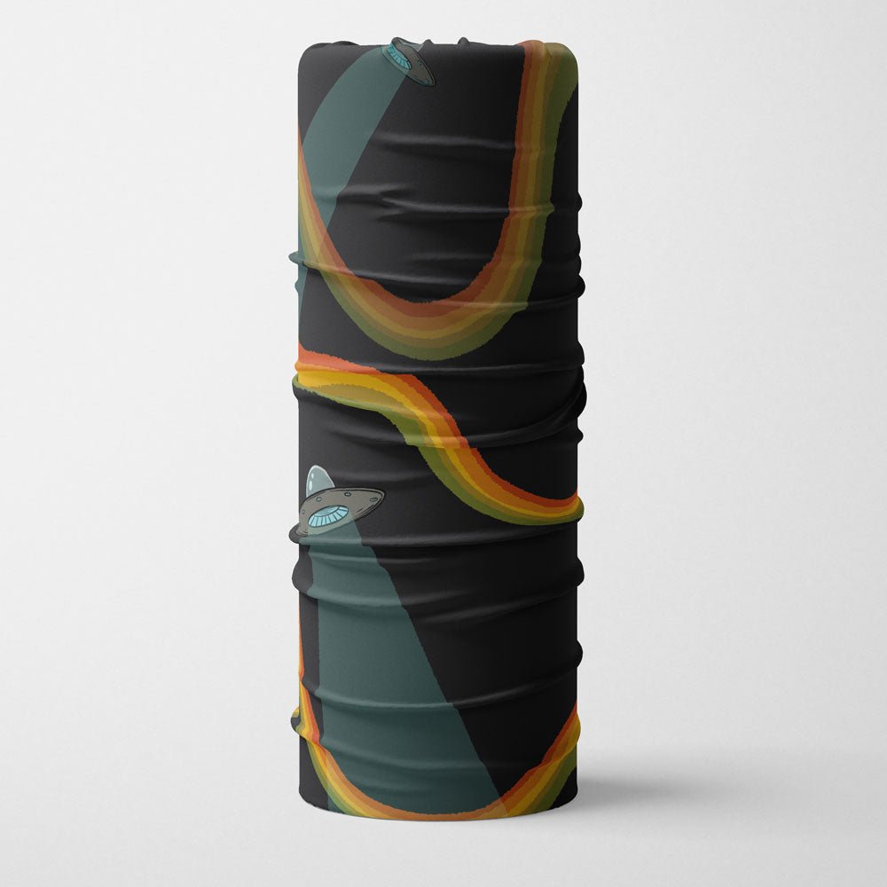 Rolled up black neck gaiter displaying the Flying Saucers UFO and rainbow pattern.