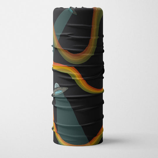 Rolled up black neck gaiter displaying the Flying Saucers UFO and rainbow pattern.
