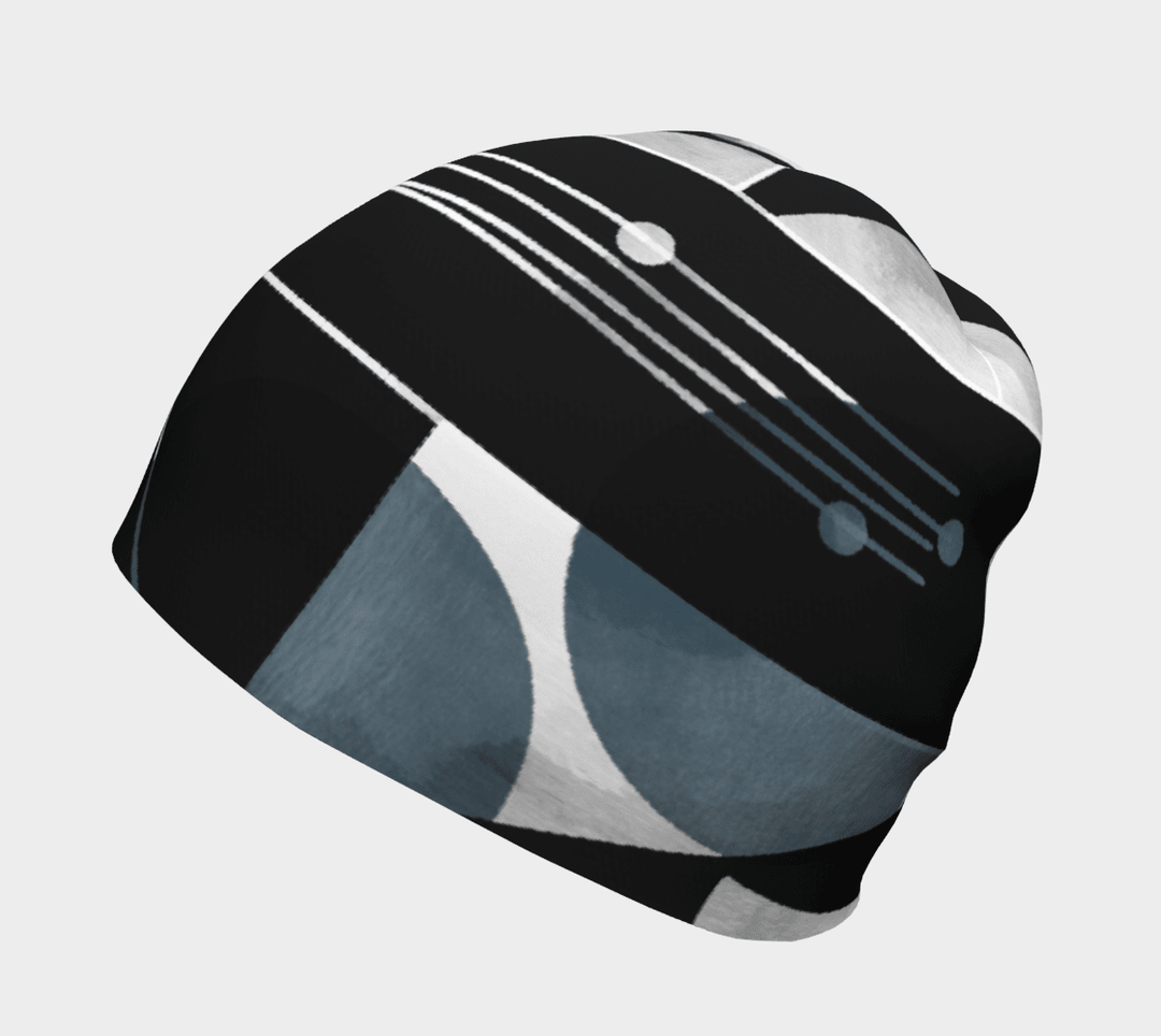 Front view of a unisex beanie showcasing its black, grey, and white geometric print.
