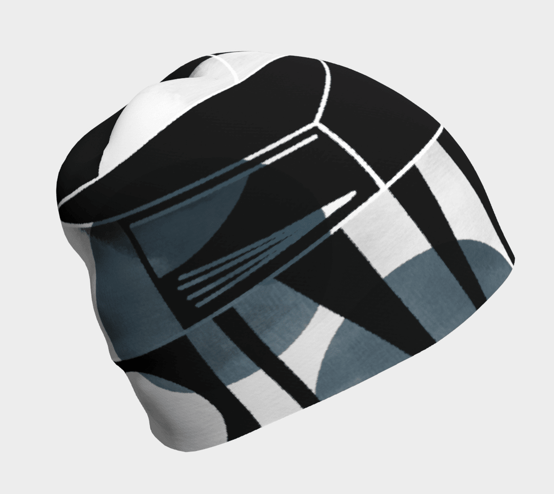 Close-up of a unisex beanie with a black, grey, and white abstract geometric pattern.