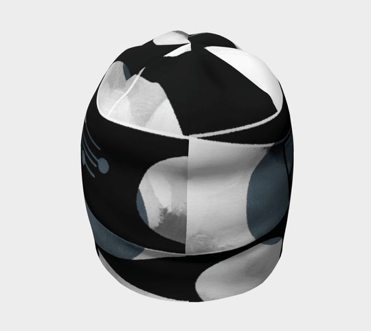 Side view of a unisex beanie with an abstract geometric pattern in black and grey.