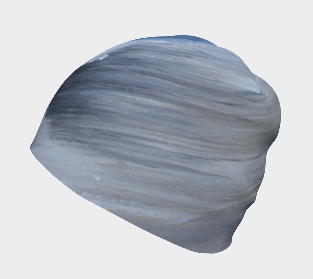 Side-back view of the Golden Sea Beanie, highlighting the flowing abstract art pattern.