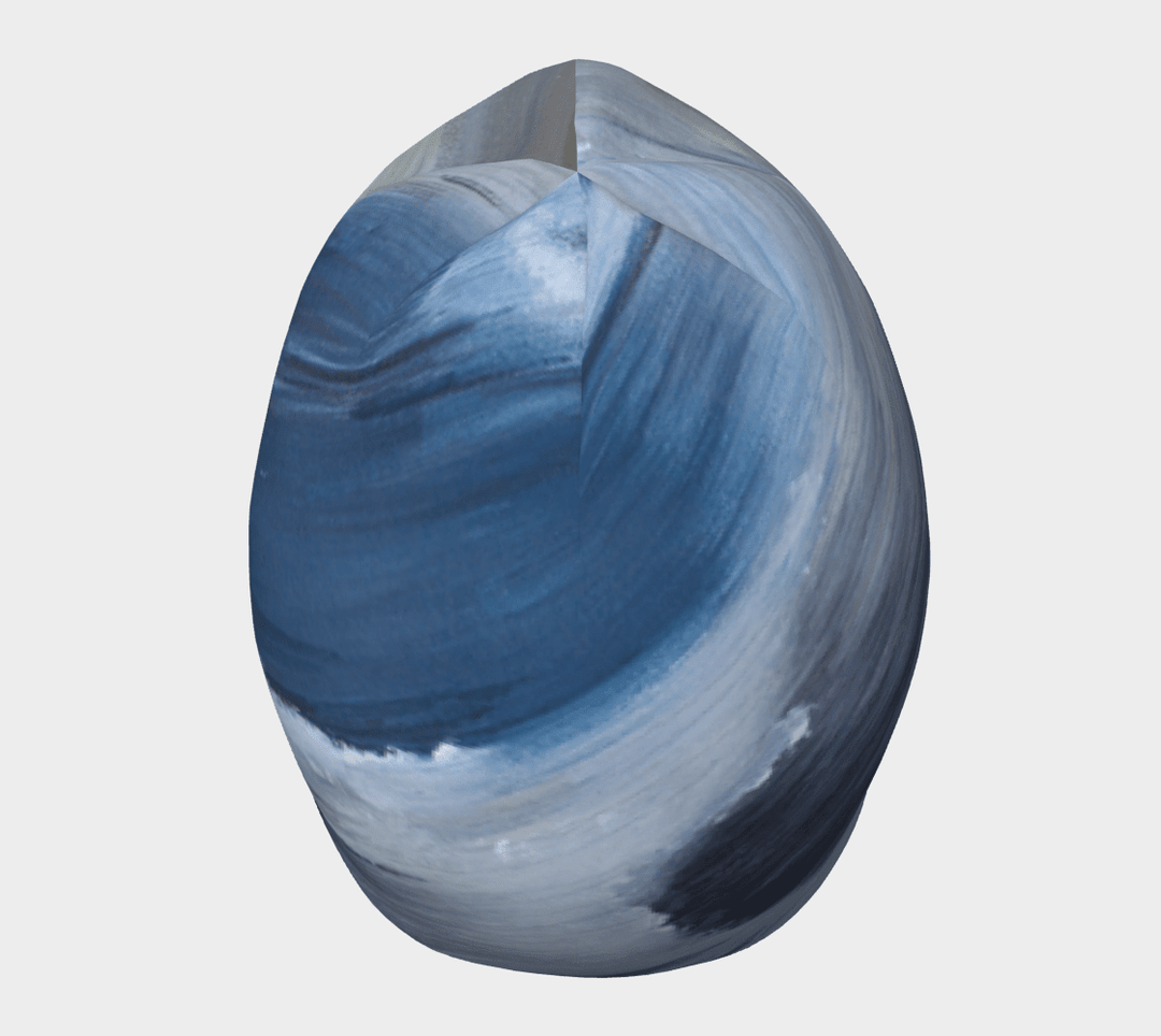 Front view of the Golden Sea Beanie, displaying the abstract brushstroke art in shades of blue and white.