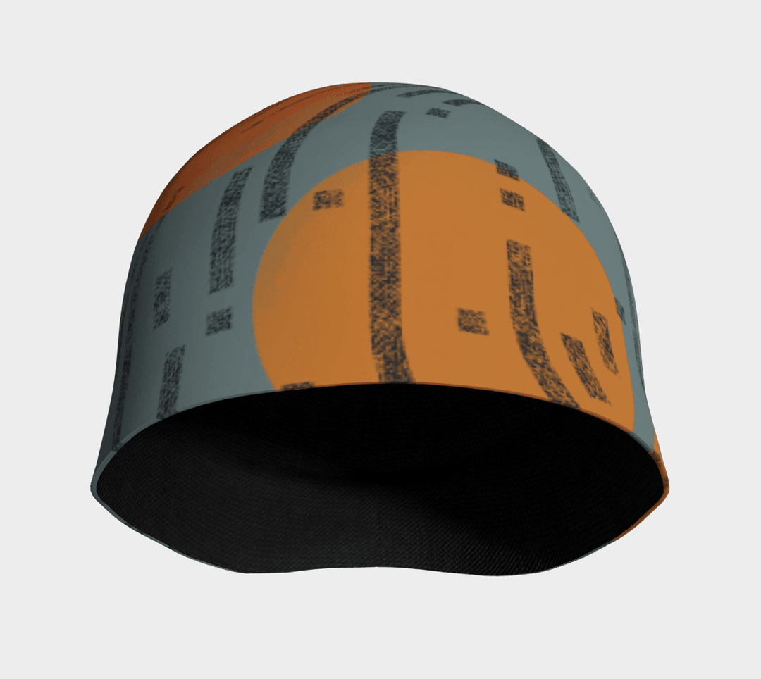 Beanie displayed face-on showing orange circle centre panel and black dashed mark pattern, black inner lining visible at brim