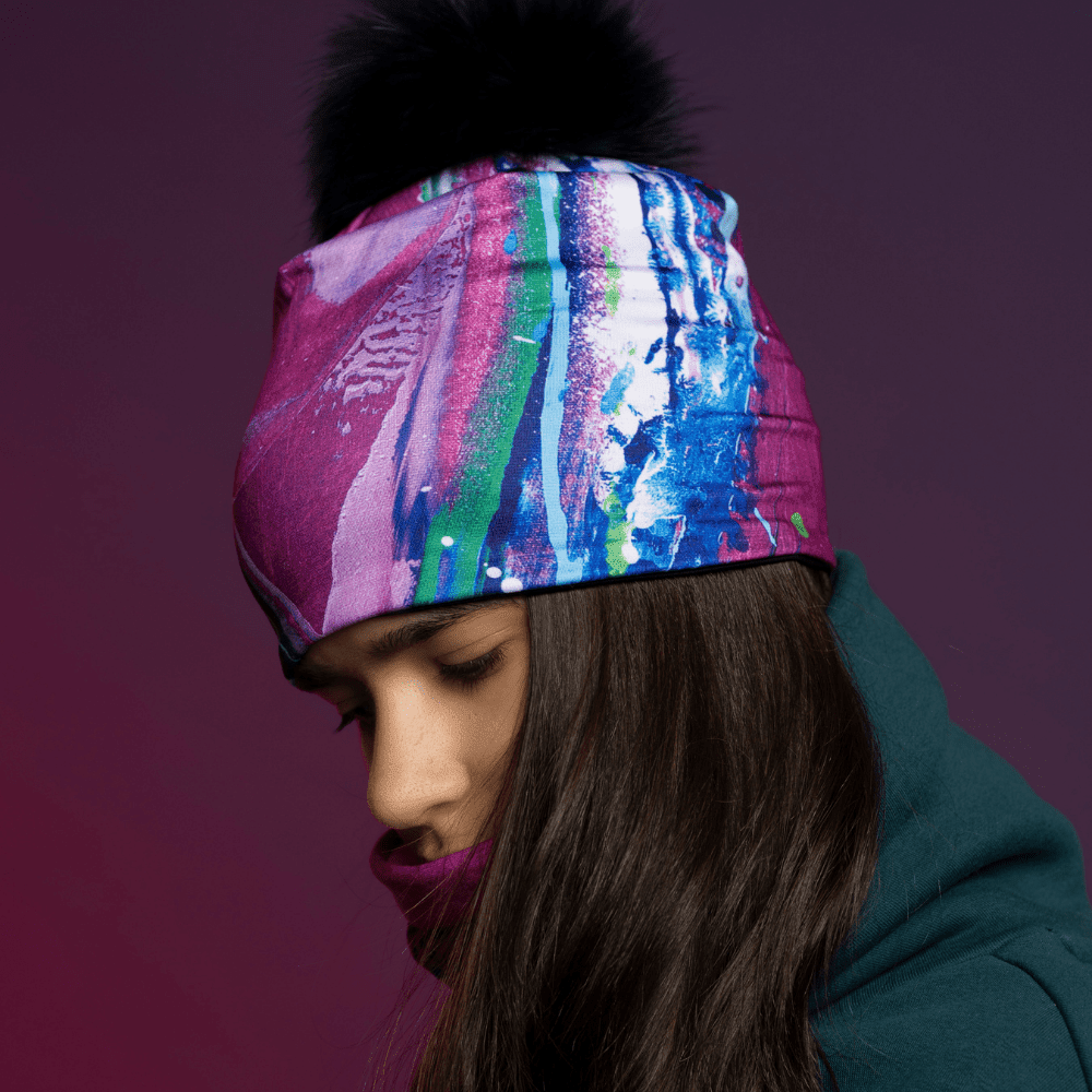 Side profile of a person wearing the Hope Beanie and neck gaiter, looking down.