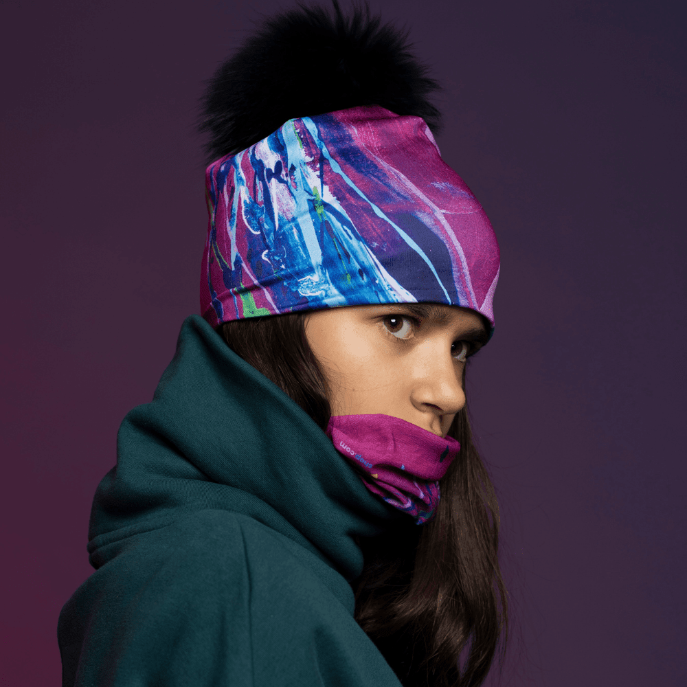 A person wearing the Hope Beanie and a matching neck gaiter, looking to the side.