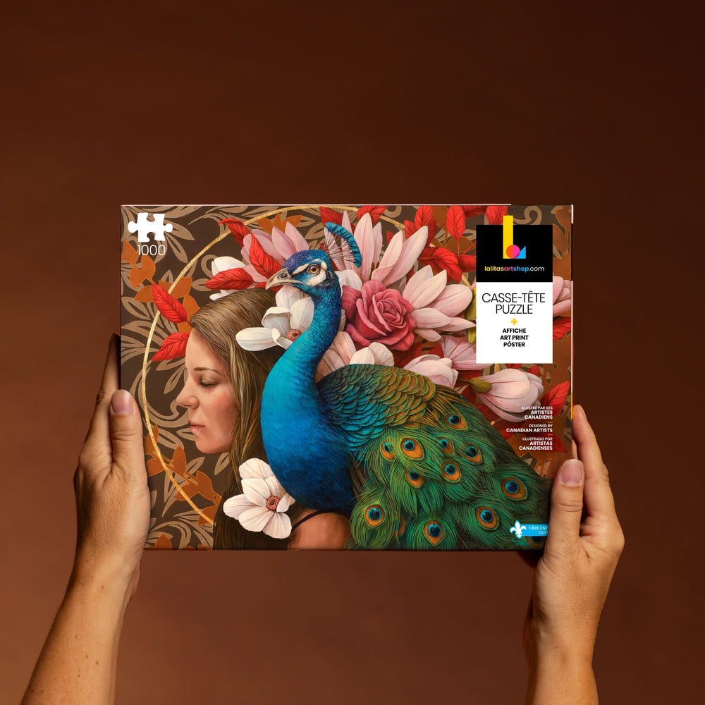 Hands holding the "Le Paon" 1000-piece jigsaw puzzle box, displaying the detailed artwork.