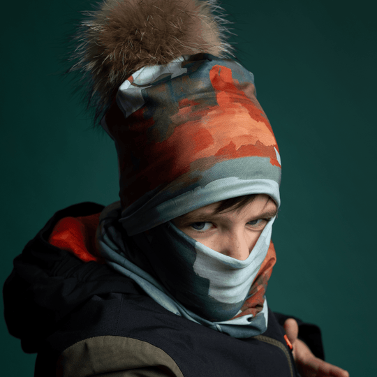 Young boy wearing the Lachine Beanie as a face mask and neck tube for cold weather.