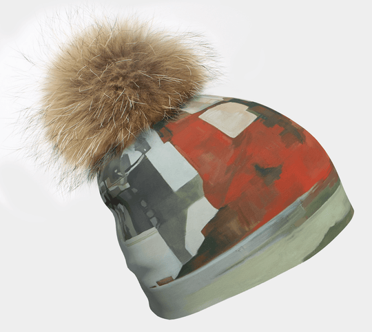 Lachine Beanie with a large, fluffy natural fur pompom on a white background.