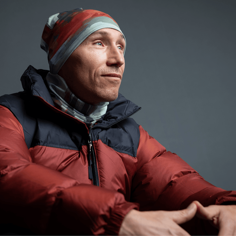 Man wearing Lachine Sports Beanie and matching neck tube with a puffy red jacket