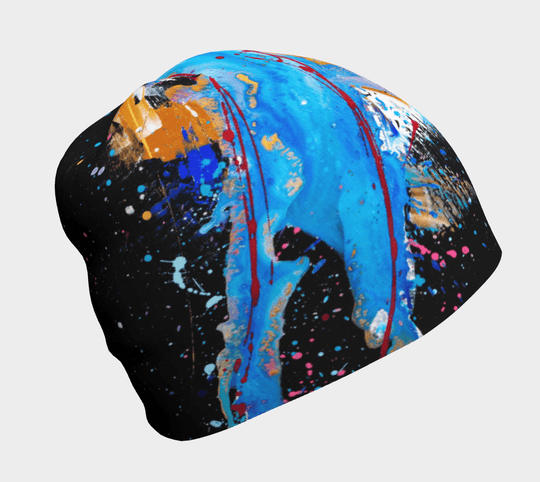 A black beanie with a vibrant abstract splatter art design in blue, magenta, gold, and white.