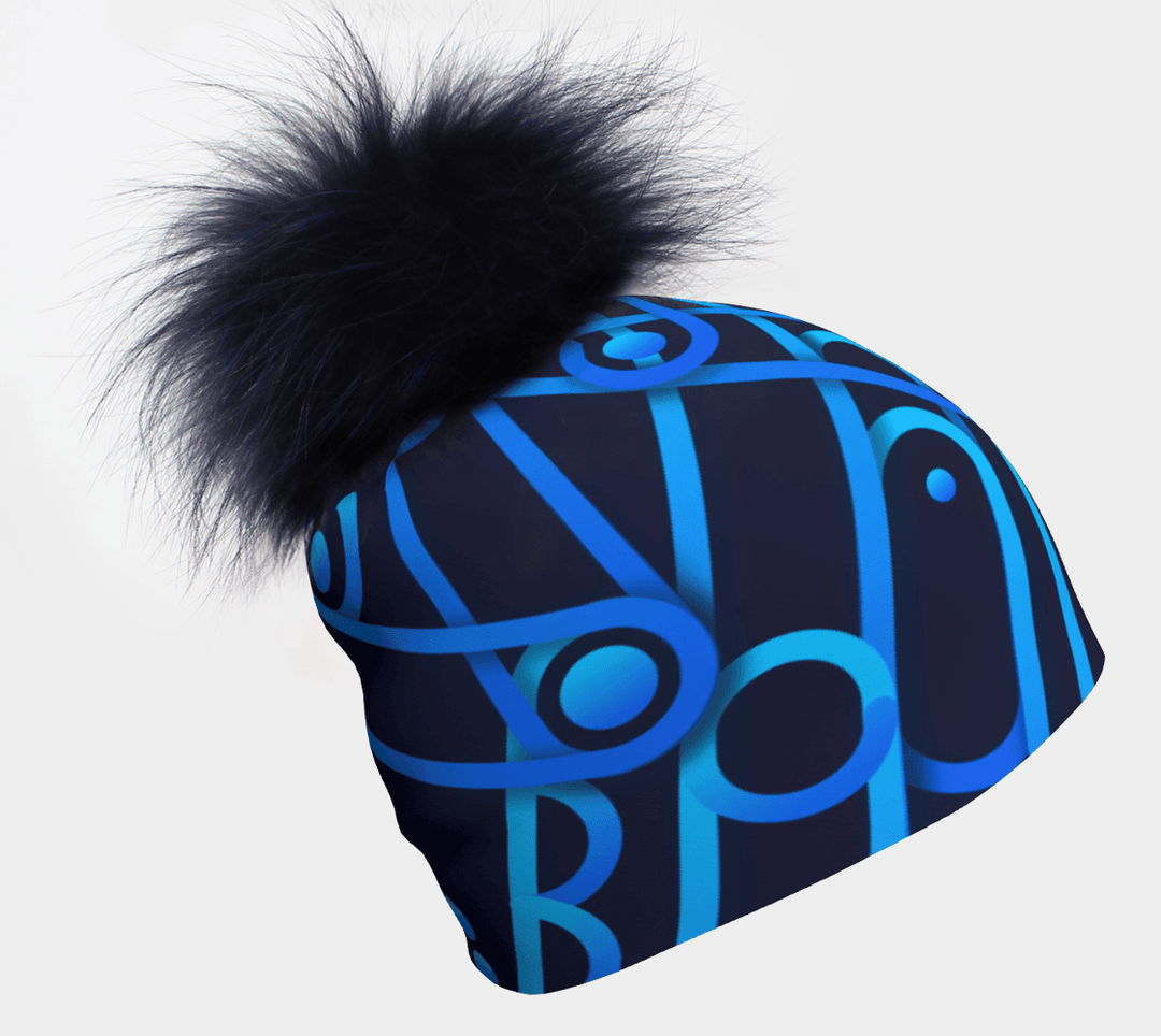 Mechanic Blue beanie with a dark blue pompom, featuring a repeating abstract blue gear pattern.